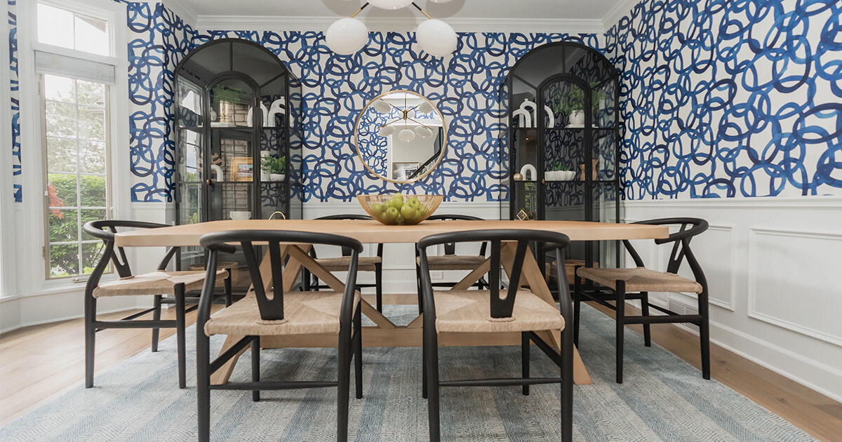 Bright and airy dining room with geometric wallpaper